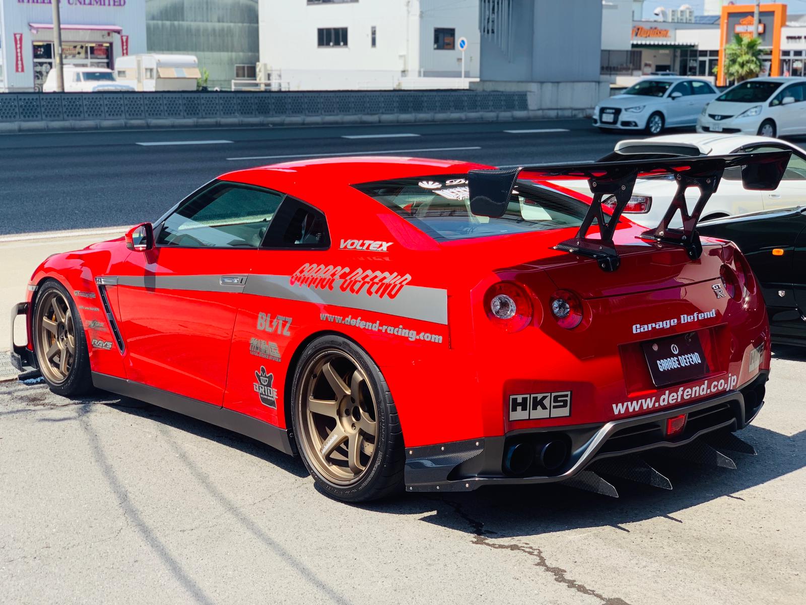 Parking Garage Nissan Gtr R Car That Has A Red Engine And Is